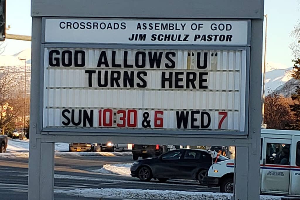 Street sign for the hours of the Crossroads Assembly of God